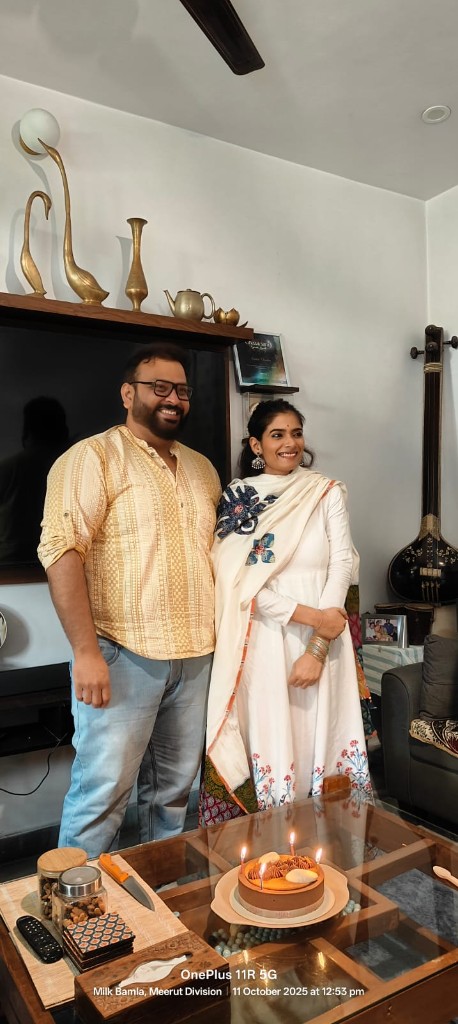 Rahul and Kashish at home with a celebration cake