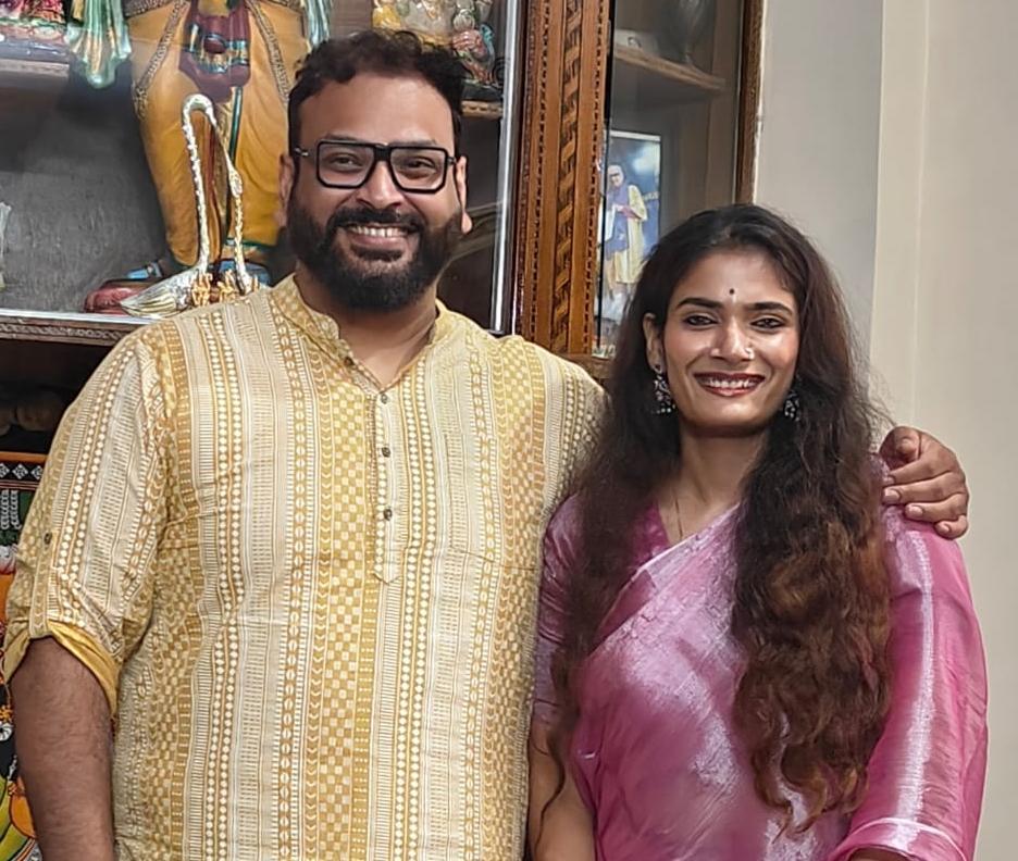 Rahul and Kashish smiling in a traditional portrait