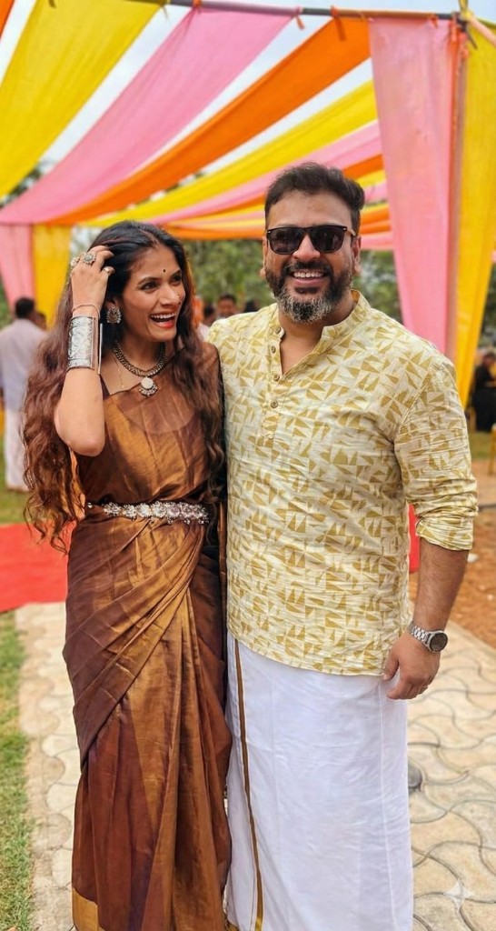 Rahul and Kashish laughing at a colorful celebration