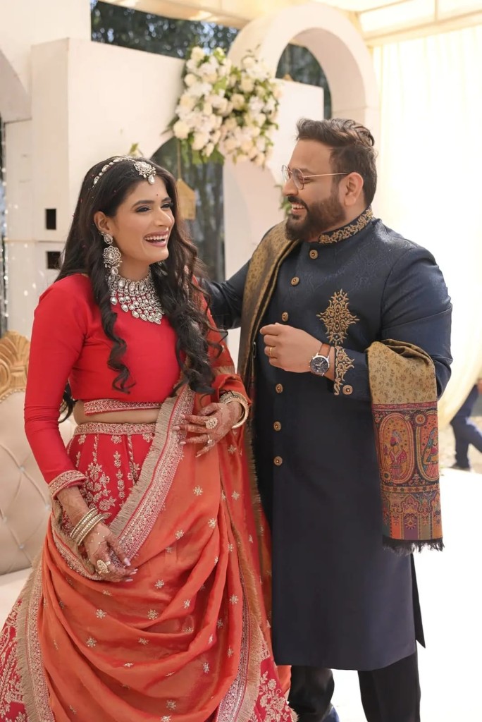 Rahul and Kashish celebrating together in traditional attire