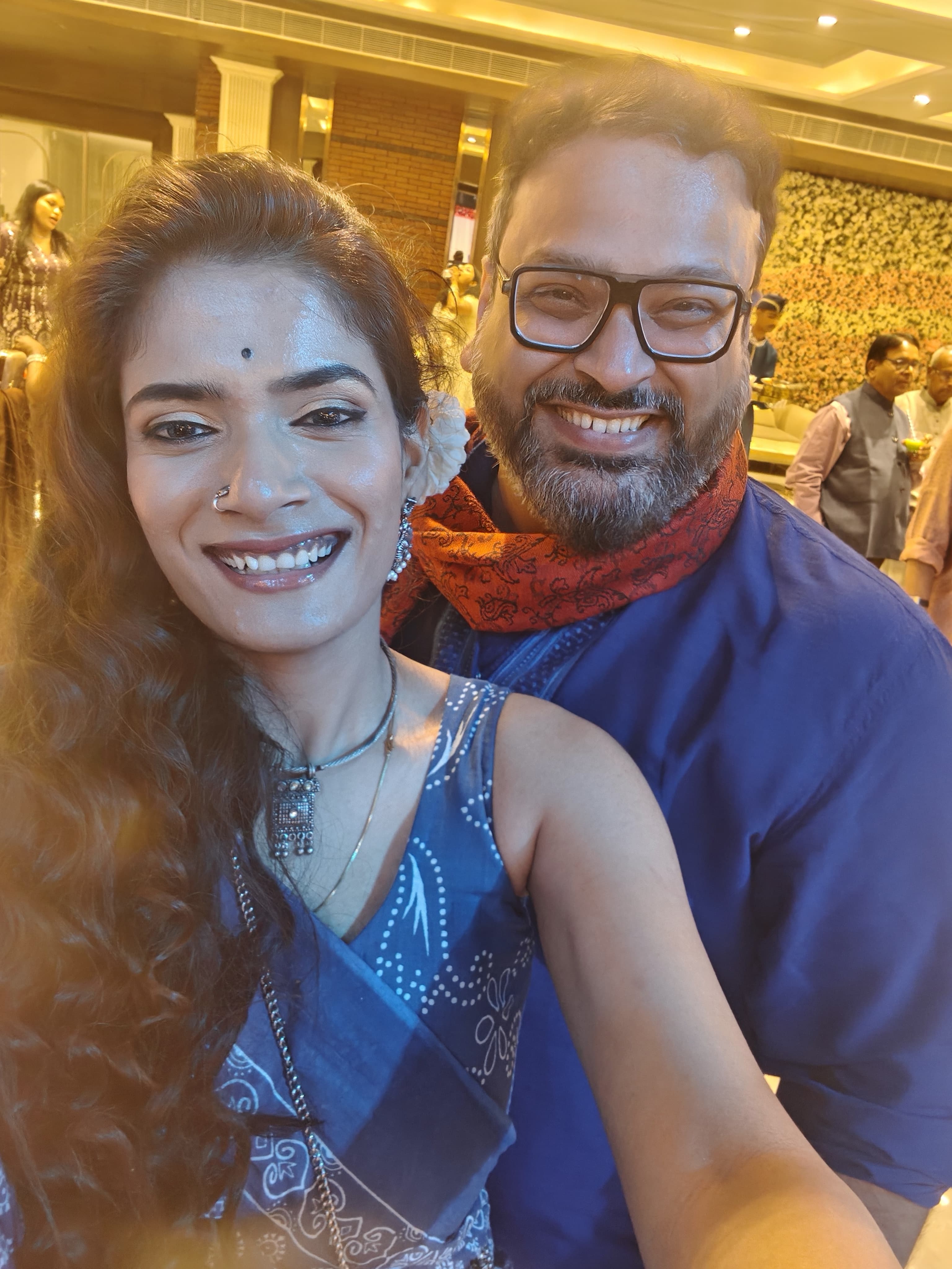 Rahul and Kashish laughing at a celebration